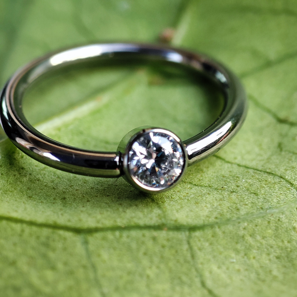 Titanium ball ring with white zirconia - TK-019