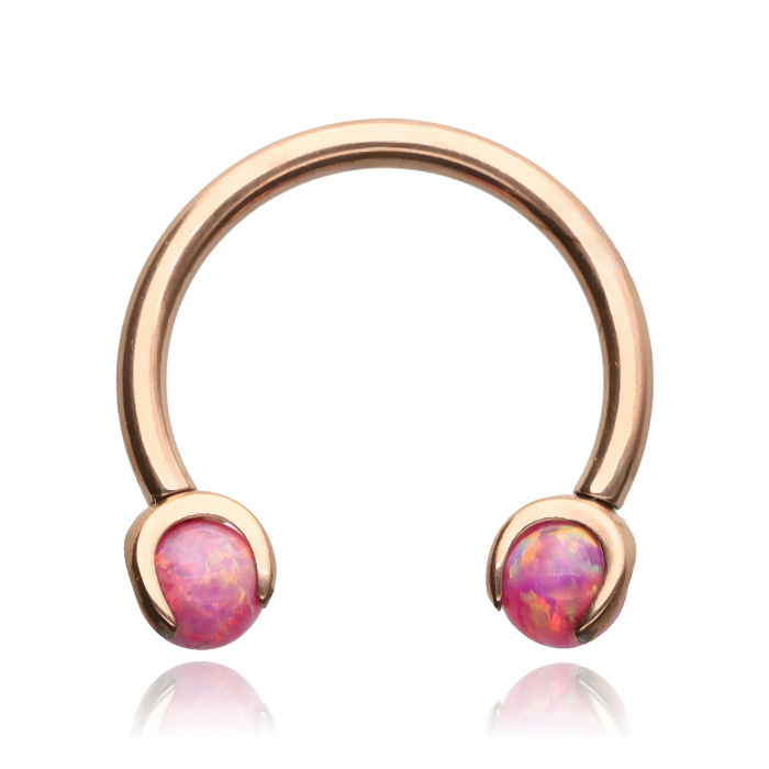 Titanium horseshoe earring in rose gold with pink opal - TKP-004